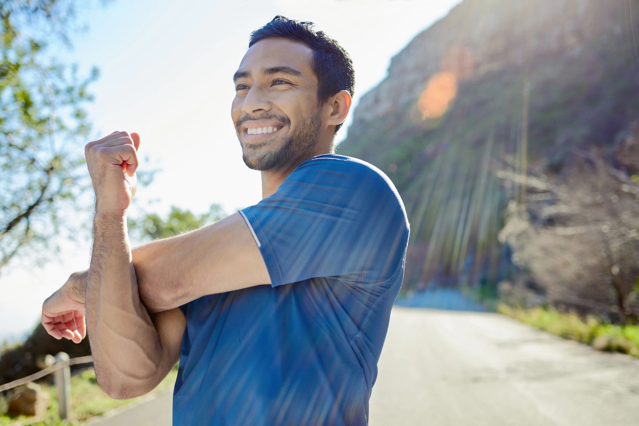 Man stretching during an outdoor workout